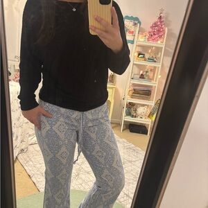 Black Sweater with Blue Patterned Pants